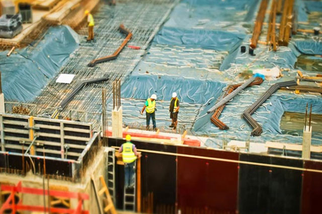 construction workers standing on a site