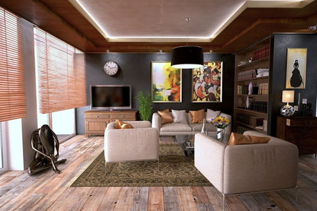 a white couch with blue pillows in a home living room
